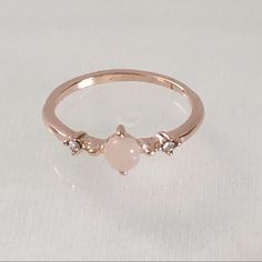 Rose Gold Plated Moonstone (Simulated) Ring. Features A Single “Moonstone” With A Single White/Clear Stone On Both Sides. Pretty When Worn Alone Or Stacked With Other Rings. Item Is New And Has Never Been Worn. Please Be Certain To Look At All The Photos Carefully. Please Do Ask Me About Any Questions You May Have Prior To Making A Purchase. Rose Quartz Ring Gold, Rose Quartz Wedding, Promise Rings Simple, Moon Ring, Rose Quartz Ring, Promise Rings For Her, Clear Stone, Quartz Ring, Promise Ring