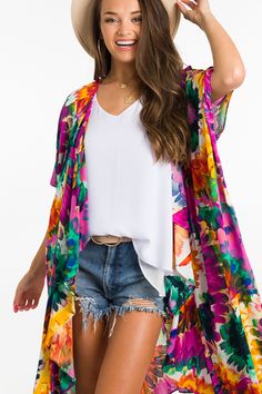 The prettiest colors we ever did see! This kimono gives you a pop of color and print, making this one so much fun + the perfect summer outfit maker. Open front and made up of 100% rayon. Summer Patterned Kimono For Beach Cover-up, Multicolor V-neck Kimono With Floral Print, Multicolor Floral Print V-neck Kimono, Multicolor Print Kimono For Spring Beach Cover-up, Casual Tropical Print Cover-up For Spring, Casual Spring Tropical Print Cover-up, Multicolor Summer Kimono For Beach Cover-up, Casual Rayon Kimono For Beach Cover-up, Flowy V-neck Kimono For Day Out