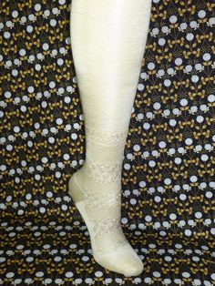 "1 pair of early 1900s Edwardian Flapper antique lace stockings.  Made of a silk, or silk blend knit in an off white color, seamed in the back. approx measurements-heel to toe-8.5\", heel to top 23\" Unstretched They are in very nice vintage condition, no stains-there is a couple small flaws/pulls-on one-as shown, appear unworn, there may be some age related spots.    TREAT YOURSELF OR SOMEONE YOU LOVE TO THESE BEAUTIFUL VINTAGE STOCKINGS!!   There are no returns due to size fit or color.   I am Fitted White Hosiery With Lace Trim, Elegant Fitted Hosiery With Lace Trim, White Stretch Lace Trim Hosiery, White Stretch Hosiery With Lace Trim, Elegant Stretch Lace Trim Hosiery, Elegant Fitted Stockings With Lace Trim, Elegant Stretch Stockings With Lace Trim, Fitted Cream Thigh-high Stockings, White Lace Fitted Stockings