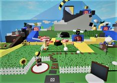 an image of a computer game with many objects on the ground and in the background