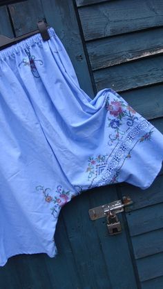 This is a pair of my harem/wide legged bloomers/pants. LISTING IS FOR PANTS ONLY XXXX These beauties have been fashioned from a vintage cotton embroidered tablecloth. These have been dyed to this fabulous and eye catching cornflower blue! The colour alone, I feel, makes these extra special but with the added embroidery and crochet work, these are amazing! These have a deep elasticated waistband for comfort and easy pull on style! A simple pull on style, freshly laundered and ready to wear.. Thes Blue Floral Embroidered Wide Leg Bottoms, Blue Bohemian Embroidered Pants, Bohemian Blue Embroidered Pants, Spring Blue Cotton Bloomers, Blue Cotton Bottoms With Embroidered Hem, Blue Floral Embroidered Pants For Summer, Embroidered Cotton Bottoms For Daywear, Vintage Blue Summer Pants, Bloomers Pants