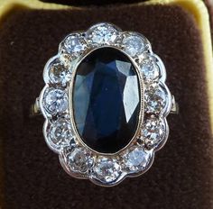 Date made: 1930's Sapphire content: 6ct Diamond content: 1.20ct Metal: 18ct white gold Condition: Excellent commensurate to it's age Finger length: 21mm Ring Size: UK S1/2   US/CAN 93/8  can be resized A stunning original art deco ring  This ring is simply breathtakingly beautiful. Catching the viewers eye is a wonderful 6ct oval cut sapphire. Measuring 13mmx9mm this has a mesmerising royal blue colour which has a rich depth too its colour, outstanding Flowing around the sapphire are twelve old Diamond Knot Ring, Edwardian Necklace, Antique Jewellery Online, Antique Rings Vintage, Gold Solitaire Ring, Three Stone Diamond, Antique Ring, Sapphire Diamond Ring, Deco Ring