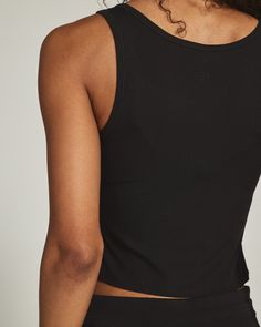 Our Core Performance® Collection combines our signature 4-Way Stretch fabric with a softer-than-ever finish that allows for all-around comfort in or outside the house. A not-so-basic crop tank. Easy to throw on, comfy, and versatile as ever – perfect for hectic weekdays and laidback weekends. Details Model is 5'10" and wears a size small. Care: Machine wash cold with similar colors. Tumble dry low. Iron on low if needed. Composition: 94% Polyester | 6% Elastane | 7DIAMONDS Women's Core™ Ribbed C Black Seamless Activewear For Everyday, Sleek Black Tops With Seamless Construction, Basic Black Tops With Seamless Construction, Casual Black Seamless Tops, Black Seamless Casual Tank Top, Sleek Black Seamless Tops, Black Medium Support Activewear, Essential Black Everyday Top, Black Ribbed Tops For Yoga