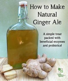 a bottle of ginger ale sitting on top of a wooden table next to sliced ginger