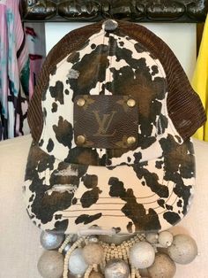 Beautiful upcycled fashion baseball caps with Original Louis Vuitton leather patches adhered to them by Keep It Gypsy. this hats are fabulous and will sell fast. We are so happy we were able to get more colors. ENJOY!!!!! :) Upcycled work handmade in the USA. This product has not been endorsed by Louis Vuitton and does not fall under any warranty by Louis Vuitton. The purchaser of the Keep It Gypsy product understands and acknowledges that the product is not a Louis Vuitton product. Trendy Brown Baseball Cap With Curved Brim, Trendy Brown Visor Baseball Cap, Casual Brown Leather Trucker Hat, Casual Brown Leather Snapback Hat, Brown Brimmed Snapback Hat For Outdoor, Brown Distressed Hats For Outdoor, Brown Country Style Baseball Cap With Curved Brim, Brown Brimmed Baseball Cap, Casual Brown Snapback Hat For Spring