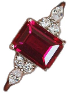 Emerald Cut Ruby Ring With Accent Stones As Gift, Dazzling Ruby Ring Gift, Dazzling Ruby Gemstone Ring For Gift, Dazzling Ruby Ring With Center Stone As Gift, Emerald Cut Ruby Ring Gift, Dazzling Ruby Ring With Prong Setting Gift, Dazzling Ruby Ring For Gift, Dazzling Ruby Ring As A Gift, Red Emerald Cut Birthstone Ring