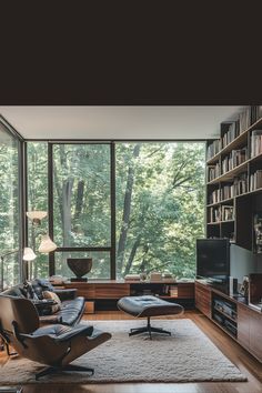 a living room filled with furniture and lots of bookshelves next to a window