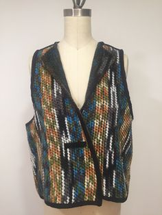 A really amazing and cozy vest made from a wool blend. It is a reversible vest, you can wear it on both sides. Closes by a metallic snap and has a large button on both side. The seams are covered by a black suede piping. The fabric is very colorful and has black, brown, olive, orange, white, turquoise, and gray stripes. The vest is comfortable, light weight and the best you can combined with different pants, skirt, or dresses giving it a unique and stylish look. Dimensions: Bust:   46 inches Len Plus Size Vest, Vest Plus Size, Cozy Vest, Reversible Vest, Clothing Designs, Large Buttons, Casual Wedding, Orange White, Grey Stripes