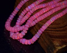 the beads are glowing pink and there is no image to describe on this page,