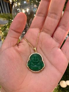 Nothing is better than wearing our abundant Buddha necklace everyday, let that money shine ✨💵 Jade is known for its wealth attracting properties and wisdom / calming properties. Information: ✨ The frame of the Buddha is surrounded with AAA+ Cubic Zirconia. ✨ The Buddha is made with genuine green Jade 💚 ✨ Materials: .925 Sterling Silver (stamped) and plated with 14K Gold. ✨ Hypoallergenic ✨ Tarnish resistant This makes awesome gift for yourself if your looking to attract peace and wealth and it Spiritual Jade Jewelry For Good Luck, Green Jewelry For Good Luck, May Birthstone, Green Gemstone Necklace For Good Luck, Spiritual Gold Emerald Necklace, Gold Spiritual Emerald Necklace, Gold Spiritual Round Emerald Necklace, Green Amulet Jewelry For May Birthstone, Spiritual Round Emerald Necklace, Spiritual Jade Necklace For Good Luck