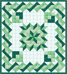 a green and white quilt with an intricate design