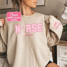 This Personalized Nurse Coquette Sweatshirt is your ultimate companion for grooving through the shift. Designed for RN, Labor and Delivery, Emergency, Pediatrics, ICU nurses, this crewneck with a pink bow is perfect for cozy evenings and chilly nights on duty! 🩺 Whether you're an RN in the intensive care department or an ICU nurse, these funny nurse designs are an excellent way to show your appreciation. It makes a fantastic gift for Nurse Appreciation Week, Christmas, Mother's Day, or a nurse' Gifting Aesthetic, Nurse Birthday, Nurse Appreciation Week, Nurse Design, Cute Nurse, Funny Nurse, Nurse Sweatshirt, Gift For Nurse, Nurse Appreciation