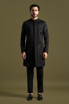 Black full sleeves achkan with gardenia thread, chir, beads, sequin embroidery and stitch line detailing on the centre panel. Paired with a trouser. - Aza Fashions Hand Embellished Long Sleeve Kurta For Eid, Elegant Hand Embellished Kurta For Reception, Hand Embellished Long Sleeve Kurta For Wedding, Hand Embellished Long Sleeve Wedding Kurta, Elegant Hand Embellished Long Sleeve Kurta, Elegant Long Sleeve Hand Embellished Kurta, Traditional Long Sleeve Hand Embellished Traditional Wear, Traditional Long Sleeve Hand Embellished Wear, Hand Embellished Long Sleeve Traditional Wear