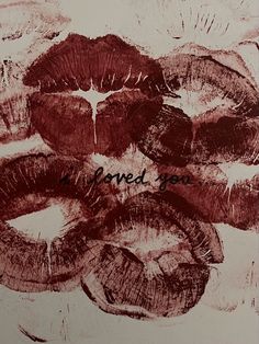 a drawing of lips with the words i loved you written in black and red ink