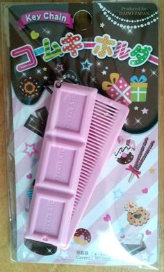 a pink comb in its packaging on a table