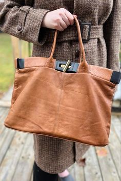 Beautiful brown leather shoulder bag/purse.  Made in Italy.  Brand: MINELLI.  It measures approx. 18.5 by 11 inches and it comes with an adjustable long shoulder strap.  Inside is nice and clean.  There is a pen mark on the leather, please refer to the photos. It is not very noticeable.  There are some light scratches as well.  No major flaws noted. Plenty of life left in this beautiful bag!! Please contact us with any questions. Thanks for stopping by! Cognac Soft Leather Shoulder Bag For Work, Cognac Leather Workwear Shoulder Bag, Brown Business Hobo Bag With Detachable Strap, Brown Rectangular Hobo Bag For Business, Brown Hobo Bag With Leather Handles For Business, Brown Top Handle Hobo Bag For Work, Brown Soft Leather Shoulder Bag For Work, Brown Satchel With Detachable Handle For Everyday Use, Brown Shoulder Bag With Detachable Handle For Everyday Use