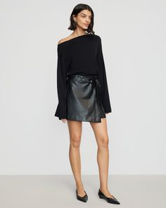 A mini skirt with a subtle edge in a soft vegan leather adds effortless polish to any wardrobe. Pair with everything from a black blouse in warmer weather to a chunky knit for a cozy look. See below for our general Size Guide and available measurements Self made of 100% polyurethane, lining made of 100% polyester Machine wash cold and lay flat to dry Versatile Black Skirt For Fall, Chic Asymmetrical Mini Skirt For Fall, Edgy Skirt For Going Out In Fall, Fall Mini Skirt In Sleek Style, Chic Winter Mini Skirt For Date Night, Fall Sleek Mini Skirt, Chic Leather Mini Skirt For Fall, Sleek Leather Mini Skirt For Fall, Fall Asymmetrical Skirt For Night Out