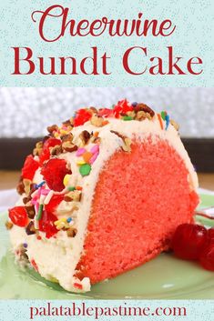 a red velvet bundt cake with white frosting and sprinkles