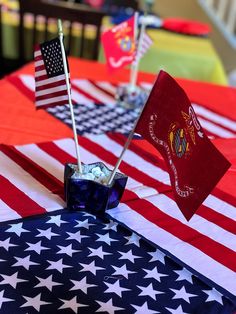 an american flag table cloth with two flags on it