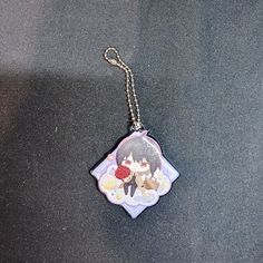 a key chain with an anime character on it