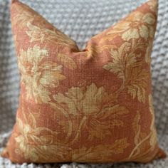 a close up of a pillow on a couch