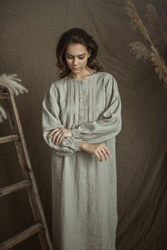 "Pure linen, long sleeved, with beautiful handstitched front yoke night gown for woman. The delicate handwork on the front creates the lightness and brings us to earlier our mum's time. That will be perfect gift for your mother or grandmother or to everybody who loves vintage. At the front fastening with 5pearl buttons, front yoke and gathering at yoke bottom. Sleeves with cuff and buttoned. Gown bottom sides are finished curved. Gown center back length - from neck line till hem - 45.5 \" (115 c Spring Long Sleeve Nightgown For Bedtime, Long Sleeve Nightgown For Spring Bedtime, Long Sleeve Lace Trim Sleepwear, Spring Long Sleeve Nightgown For Night, Spring Long Sleeve Nightgown With Lace Trim, Spring Long Sleeve Lace Trim Nightgown, Long Sleeve Bedtime Dress For Spring, Elegant Long Sleeve Nightgown For Home, Elegant Long Sleeve Spring Nightgown