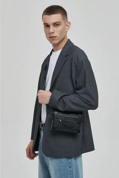 Meet your new go-to accessory: the Crossbody Box Bag with Attached Chain Detail, where style meets practicality.

Crafted with an edgy mix of textures and a thoughtfully designed pattern, this bag is made for those who appreciate a touch of moody sophistication. The exterior boasts a durable, grainy finish complemented by a bold chain detail, offering a juxtaposition of nonchalance and polish. Inside, the bag features a neatly organized compartment with a dedicated space to secure your essential Edgy Rectangular Shoulder Bag For Everyday, Edgy Rectangular Shoulder Bag, Edgy Rectangular Shoulder Bag With Chain Strap, Modern Travel Bag With Chain Detail, Modern Crossbody Box Bag With Chain Strap, Modern Box Bag With Chain Strap, Modern Box Bag With Chain Strap For Everyday Use, Modern Clutch Box Bag With Chain Strap, Modern Pouch Shoulder Bag With Chain Strap