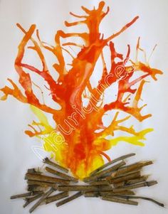 an orange and yellow tree made out of sticks with watercolors on the branches