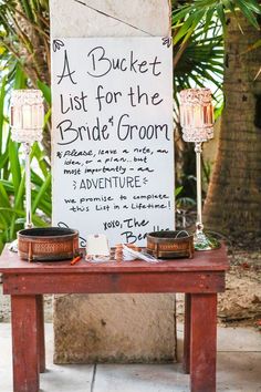 a sign that says bucket list for the bride's groom on top of a table