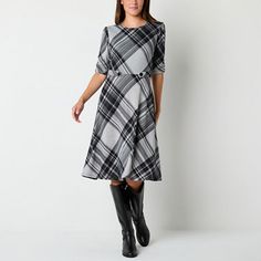 You'll feel chic for work or play in this R&K Originals women's plaid fit and flare dress come fall and winter. Made from a stretchy knit in a cool black and charcoal plaid pattern, it features 3/4 ruched sleeves and a button-adorned waist trim to add definition to your figure. Wear it with tall boots and your favorite accessories. Closure Type: ButtonNeckline: Crew NeckSleeve Length: 3/4 SleeveSleeve Style: Ruched SleeveApparel Length: 42 InchesDress Length: Knee LengthFiber Content: 97% Polyes Plaid Midi Dress For Fall Workwear, Fall Workwear Midi Dress With Half Sleeves, Fall Fitted Knee-length Plaid Dress, Fitted Knee-length Plaid Dress For Fall, Fitted A-line Plaid Dress For Fall, Half-sleeve Fall Workwear Dresses, Fall Half-sleeve Workwear Dress, Fall Plaid Dress For Workwear, Winter Workwear Dresses With 3/4 Sleeves