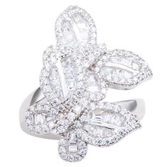 With elegance and subtlety, this Suzy Levian butterfly collection creation has become an icon of class, luxury and style. Let your creative side shine through with this whimsical double butterfly ring featuring white round and baguette shape cubic zirconia, hand set in sterling silver. This ring is designed by Suzy Levian with a message. By creating jewelry that is beautiful inside and out, Suzy Levian 's message is revealed through a hidden stone set inside the shank of this ring to empower wom Double Butterfly, Ladies Rings, Butterfly Collection, Butterfly Ring, Beautiful Inside And Out, Creating Jewelry, Branded Gifts, Mens Gift Sets, Stone Settings