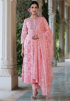 Readymade Pure Cotton Anarkali Kameez in Pink This Round Neck and Quarter Sleeves attire is Enhanced with Floral and Zig Zag Print Available with a Pure Cotton Pant in Pink and a Pure Cotton Dupatta in Pink The Kameez and Bottom Lengths are 42 and 38 inches respectively Do Note: Accessories shown in the image are for presentation purposes only and length may vary upto 2 inches.(Slight variation in actual color vs. image is possible). Maxi Length Salwar Kameez With Printed Motifs For Diwali, Diwali Floor-length Churidar With Printed Motifs, Cotton Floor-length Salwar Kameez, Diwali Maxi Length Churidar With Printed Motifs, Diwali Maxi Length Printed Churidar, Diwali Churidar With Printed Motifs In Maxi Length, Diwali Churidar With Printed Motifs, Anarkali Unstitched Suit With Printed Motifs, Pink Anarkali Palazzo Set With Printed Motifs