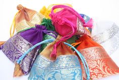 Pretty Organza Jewelry bags, You want to stand out from the crowd give your customers your jewelry pieces in these gorgeous colorful pouches. Not your typical Organza bags, these have a lovely bottom brocade trim. They come in a pack of 100 assorted colors each prettier then the other. They are well made so your customer can keep them to store the item they bought. Each pouch measures 4x4 inches and has a satin cord drawstring. I have other pouches I can source as well , so if you have something Festival Party Gift Bag Pouch, Festive Party Gift Bag Pouch, Elegant Festival Gift Bags, Elegant Multicolor Pouch For Festivals, Elegant Festival Bags For Gifts, Elegant Festival Bags Suitable For Gifts, Festive Multicolor Rectangular Potli Bag, Pink Bags For Diwali Gift, Pink Bag For Diwali Gift