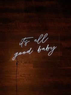 it's all good baby neon sign on the wall