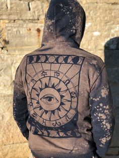 This is a made to order listing so please allow for up to 2 weeks for production time. Please select your desired size at checkout! This unisex size hoodie is hand dyed with a unique palmistry hand on the front. The back has a large astrology chart with an all seeing eye: This piece is a rich navy blue with our signature space wash effect! We added beautiful tribal fabric to both of the front pockets and the hood. Please note- the listing picture was taken outside in direct sunlight. The hoodie Black Bohemian Hoodie, Bohemian Cotton Hoodie For Festival, Bohemian Hoodie For Festivals, Hand Astrology, Boho Hoodie, Elephant Sweatshirt, Palmistry Hand, Boho Sweatshirt, Drop Shoulder Hoodie