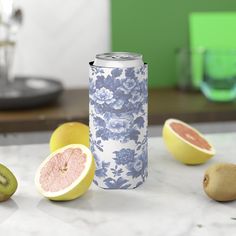 a can of watermelon and kiwi on a marble counter with other fruit