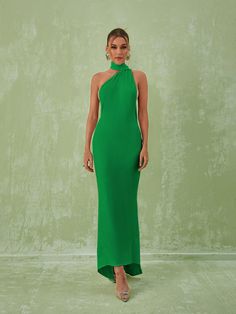 Toula Backless Maxi Dress In Green offers the perfect combination of coverage and elegance. The floor-skimming silhouette features a backless design with a ruched detail that creates an alluring yet modest look. The lightweight fabric will keep you feeling cool and comfortable throughout the day. Material: 83% Polyester, 17% Spandex Stretch Factor: High Stretch Clean: Gentle machine wash Color may vary due to the lighting on images. The product images (without model) are the closest to the true Sleeveless Backless Dress With Ruched Bodice For Night Out, Party Maxi Dress With Tie Back, Solid Color Maxi Dress With Tie Back For Party, Chic Bodycon Maxi Dress With Ruched Back, Evening Backless Halter Dress, Evening Halter Backless Dress, Chic Stretch Maxi Dress With Ruched Back, Chic Green Backless Dress With Tie Back, Solid Color Maxi Dress With Ruched Back