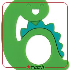 a close up of a green object with a smiling face in the shape of a letter o