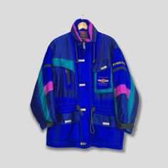 "Vintage 90's Multicolor Retro Skiing Bomber Parka Jacket Large Fablice Japan Snow Gear Jacket Outerwear Cold Weather Ski Wear Blue Hoodie Size L Please contact me for any questions about this clothing before buying. Size on tag : Size L (check measurements below) Measurement : Armpit to armpit : 24\" inches Back collar to hem (total length) : 30\" inches Weight : 1.33 kg Condition : Good Condition. No holes and stains. Delivery / Postage :- DHL EXPRESS / EXPEDITED = 3-5 business day. **WE ARE U Blue Hooded Windbreaker For Winter Sports, Blue Long Sleeve Skiing Jacket, Blue Long Sleeve Outerwear For Skiing, Retro Hooded Outerwear For Ski Season, 90s Style Winter Windbreaker With Pockets, Hooded Blue Skiing Outerwear, Blue Outerwear For Ski Season Outdoor Activities, Blue Hooded Skiing Outerwear, Blue Outerwear For Ski Season And Outdoor Activities