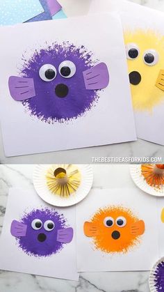 some paper plates with different colored animal faces on them and one is made out of construction paper