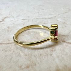 Fine vintage handcrafted 18 Karat yellow gold Toi-Et-Moi (bypass) ring set with 2 oval rubies weighing approximately 0.50 carat, and 2 round diamonds weighing approximately 0.05 carat, F-G VS. Stamped 750 with maker’s marks. This ring is a size 7.75 US / P 1/2 UK. > Resizing not included. This ring can be resized to fit most fingers. Please contact us for details. Resized rings are final sale. It weighs 2.3 grams. Birthstone: July/April. Condition: Very good. Minute scratches throughout metal. L Resize Ring, Bypass Ring, Maker’s Mark, Ruby Diamond, Buy Vintage, Yellow Gold Rings, Ring Set, Ring Sets, Round Diamonds