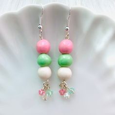 "Add some fun flair to your outfit with kawaii food jewelry! These dango mochi polymer clay earrings make a great gift for yourself or foodie friend. Comes with silver steel hypoallergenic earrings and embellished with genuine swarovski crystals. - Dimensions: 1.25\" tall (2\" with earring hooks) - Silver-plated surgical steel hypo-allergenic earring hooks - Dango is coated in UV resin for protection and shine Comes ready for gifting with cute packaging! Note: Some items are made to order, so pl Kawaii Hypoallergenic Drop Earrings, Kawaii Drop Earrings, Kawaii Dangle Earrings With Ear Wire, Kawaii Style Drop Earrings, Cute Multicolor Hypoallergenic Earrings, Whimsical Handmade Earrings For Birthday, Birthday Dangle Single Earring, Kawaii Drop Earrings As Gift, Cute Green Earrings For Birthday