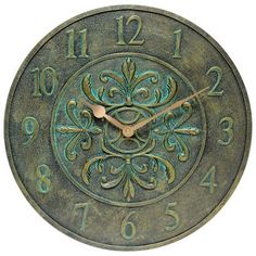 a clock that is on the wall with numbers and symbols in green color, isolated against a white background