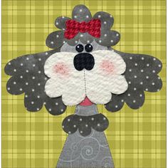 a paper doll made to look like a dog with a bow on it's head