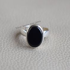 Gemstone-Black Onyx Shape-Oval Metal-925 Sterling Silver This One of a kind ring is adorned with beautiful Black Onyx gemstone in sterling silver.Black Onyx is the birthstone representing the month of December. About gemstone- Black Onyx is the birthstone for Leo. It is the stone of protection.This elegant smooth textured stone is said to have immense healing and spiritual benefits.Black Onyx symbolizes peace,harmony and love and good luck.Black Onyx is well known to remove negativity and act as Black Oval Cabochon Jewelry For Anniversary, Oval Onyx Rings For Anniversary, Onyx Oval Cabochon Rings For Gift, Oval Cabochon Onyx Ring Gift, Stone Ring Design, Birthstone Promise Rings, Black Stone Ring, Silver Ring Designs, Jewelry Design Earrings