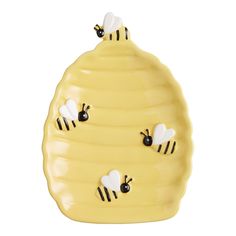 three bees on a yellow honeycomb with black dots and white stripes, one in the shape of a beehive