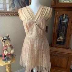 This Is A New Party, Wedding, Dance Dress! It Is Beautifully Embroidered And The Color Is Biscuit. Parts Of It Are Silk ,But Not Sure The Skirt Material? It’s Kind Of Stiff Material That Holds Its Shape But Not Too Stiff And Is Lined. Has Cute Buttons On The Front And Extra. Summer Wedding Vintage V-neck Dress, Vintage V-neck Wedding Dress, Spring Wedding Vintage Dress With V-neck, Fitted Lace Dress With Lined Bodice For Evening, Lace V-neck Dress With Fitted Bodice, Beige Vintage V-neck Dress, Beige Lace Dress With Fitted Bodice, Cream Sleeveless Dressy Dress, Summer Vintage V-neck Wedding Dress