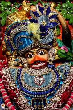 an elaborately decorated mask on display in a store