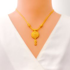 This 22k yellow gold necklace set, weighing 19.5 grams, features an intricate floral dome design that highlights the exquisite craftsmanship. The necklace measures 16 inches in length, with a 1.6-inch drop, and includes 1.75-inch adjustable links, secured by a hook lock for a secure fit. The set is complemented by matching earrings, each 1.6 inches long, with screw-back posts for a comfortable and secure wear. This set is perfect for those who appreciate detailed and elegant jewelry. PRODUCT DET Yellow 22k Gold Round Necklace, 22k Gold Necklaces With Intricate Design, 22k Gold Filigree Necklaces, Intricate Design 22k Gold Necklace, 22k Gold Filigree Yellow Necklaces, 22k Gold Round Pendant Necklace With Intricate Design, 22k Gold Necklace With Intricate Round Pendant, 22k Gold Necklace With Round Pendant And Intricate Design, 22k Gold Yellow Necklace With Round Pendant