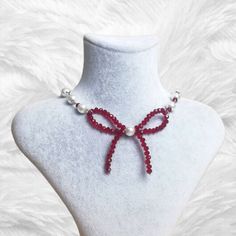 Fairy red cute coquette beaded bow necklace ❤ ▪ Made with glass pearl, check beads and chain 🌸 ▪ 35 cm and adjustable ▪ It is handmade 💗 ▪ Avoid contact with perfume or other chemicals 🌿 Fairycore Pearl Necklace For Gift, Fairycore Pearl Necklace For A Gift, Adjustable Fairycore Necklaces For Party, Cute Red Necklace For Parties, Aesthetic Pearl Necklace, Soft Angel Aesthetic, Fairy Choker, Necklace Coquette, Coquette Jewelry